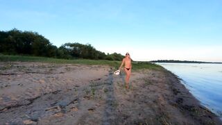 Russian Nudist on the River Shore