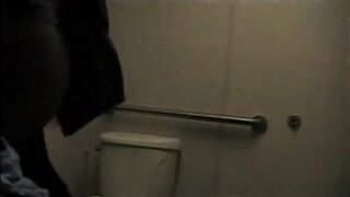 Big-Titted Black Amateur Has Interracial Sex in a Public Bathroom