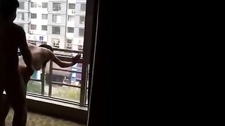 Asian Girl Shared at Open Window